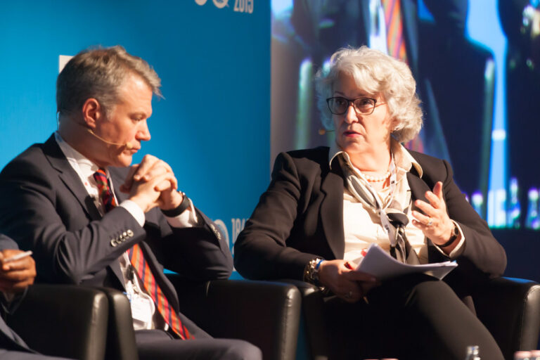 Speakers in conversation at a technology conference